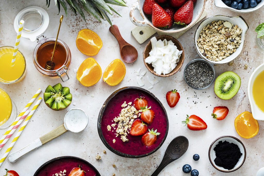 preparing-acai-bowl-flat-lay-style-with-tropical-fruits-grains-food-design-